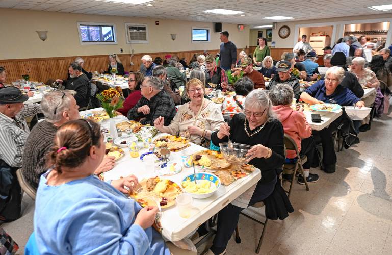 People enjoy the community meal put on at Athol American Legion Post 102 on Thanksgiving.