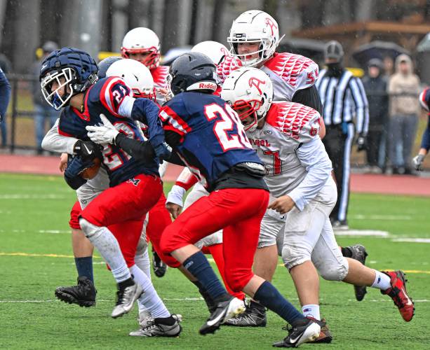 Mahar's Carter Hardy fight for more yards against Athol in Orange on Thursday.