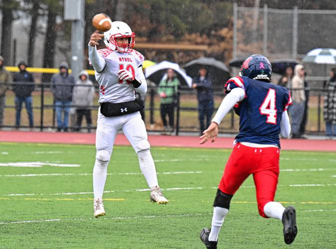 Athol’s Aidan Melanson tosses a pass to Sawyer Lefsyk who took it to the house early in the first quarter to give Athol the lead over Mahar in Orange on Thursday.