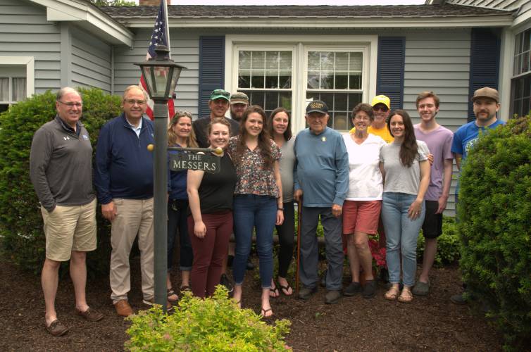 Bill Messer celebrates his 100th birthday alongside his family in 2023.  