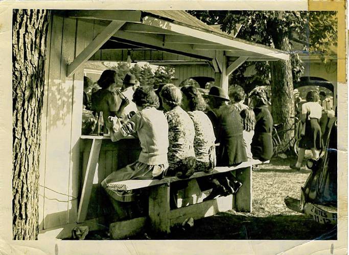 Attendees of the Franklin County Fair eat at the Leyden United Methodist Church’s food booth in September of 1943.