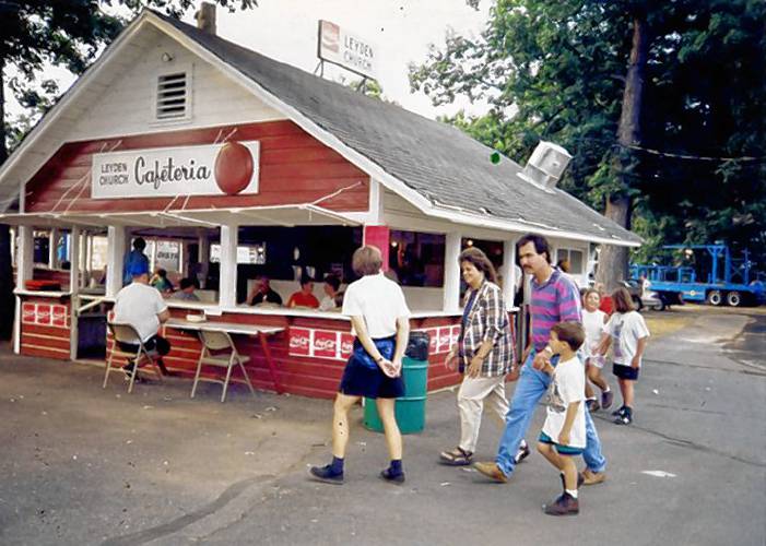 Attendees of the Franklin County Fair visit the Leyden United Methodist Church’s food booth sometime in the 1970s.