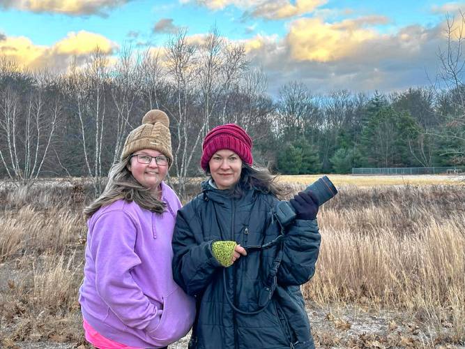 Jade Bailey, who volunteers to run the North Quabbin Dog Park in Orange, left, and photographer and dog owner Kirsten Spencer at last weekend’s dog photo shoot to raise money for the dog park. The fundraiser generated at least $325.