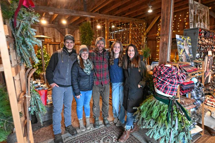 Buxton Christmas Barn sells Christmas trees, wreaths, gifts and apparel on Cross Road in Northfield. From left are Cole Gamache, Leaha Connor, John Buxton, Macy Buxton and Jenny Buxton.