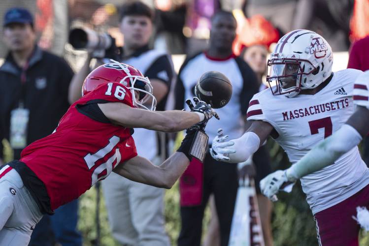 UMass defensive back Lake Ellis (7) breaks up a pass intended for Georgia wide receiver London Humphreys (16) on Saturday in Athens, Ga.