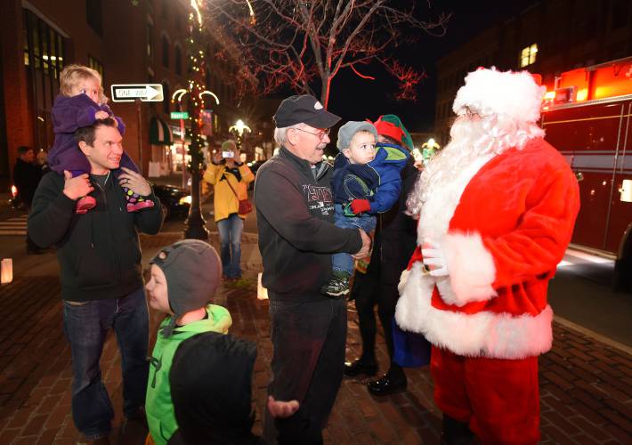 Attendees of a previous Jingle Fest visit with Santa in Greenfield. The three-day festival is back for its 11th year starting on Friday.