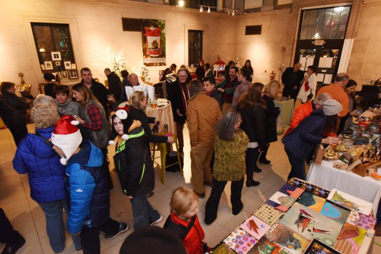 People shop at the Holiday Pop-up Market at the Pushkin Gallery in Greenfield in 2017 as part of the annual Jingle Fest celebration. The three-day festival is back for its 11th year starting on Friday.