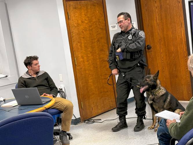 Montague Police Officer James Ruddock introduces the Selectboard to the Police Department’s new K-9, Lawrence “Larry” Akim, on Monday.