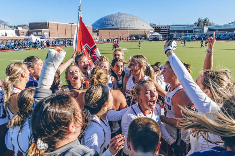 The UMass field hockey team celebrates its 2-1 comeback win over UConn in the NCAA Tournament Round of 16 on Nov. 15 in Storrs, Conn.