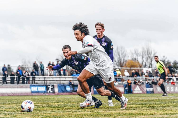 UMass’ Oliver Akintade (29) sprints away from an Evansville defender during the Minutemen’s 2-1 first-round win over the Aces on Noc. 21 in Amherst, Mass.