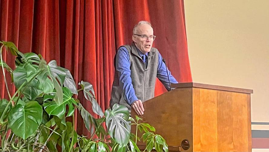 Longtime climate activist Bill McKibben speaks to a packed audience at the University of Massachusetts Amherst’s Old Chapel on Monday about the realities of the climate crisis. 