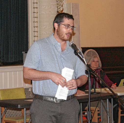 Orange Town Administrator Matthew Fortier speaks to voters in Orange Town Hall’s Ruth B. Smith Auditorium during a Special Town Meeting on Monday.