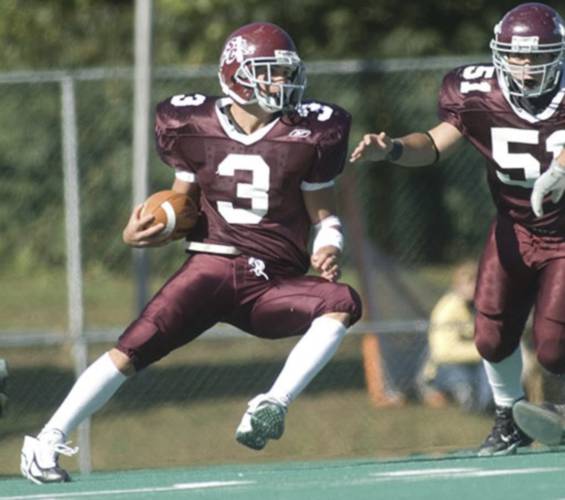 Joe Harasymiak after coming down with an interception during his playing days at Springfield College. Harasymiak was hired as UMass football’s next head coach on Wednesday afternoon.