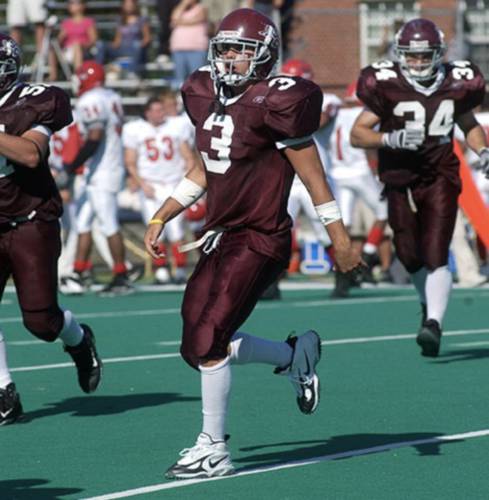 Joe Harasymiak jogs off the field during his playing days at Springfield College. Harasymiak was hired as UMass football’s next head coach on Wednesday afternoon.