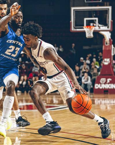 UMass’ Jaylen Curry (0) drives to the basket on a Central Connecticut State defender during the Minutemen’s 73-69 loss to the Blue Devils on Wednesday night at Mullins Center.