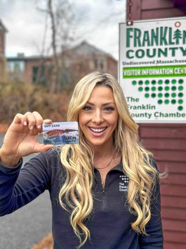 Jessye Deane, executive director of the Franklin County Chamber of Commerce, holds a Franklin County Gift Card.