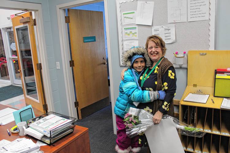 Newton School students welcomed their new interim principal, Carol Jacobs, with a poster and flower bouquet on her first day on Thursday.