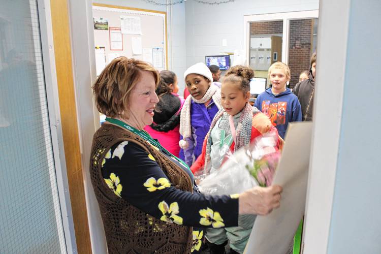 Newton School students welcomed their new interim principal, Carol Jacobs, with a poster and flower bouquet on her first day on Thursday.