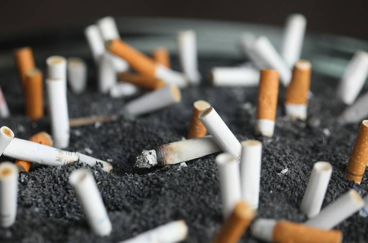 Cigarette butts sit in an ashtray in New York. A trio of Massachusetts legislators announced they plan to co-sponsor legislation aimed at eventually ending the sale of all nicotine and tobacco products in Massachusetts. Sen. Jason Lewis, D-Winchester, and Reps. Tommy Vitolo, D-Brookline, and Kate Lipper-Garabedian, D-Melrose, said they will file the bill for consideration in the 2025-2026 legislative session.