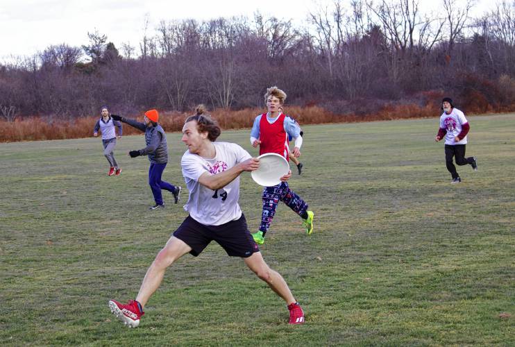 Kai Delorenzo prepares to throw the Frisbee while playing with the ultimate Frisbee pickup group in Greenfield.