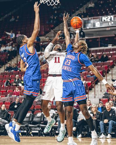 UMass sophomore Jayden Ndjigue (11) puts up a shot during the Minutemen’s 96-83 loss to UMass Lowell on Saturday afternoon at Mullins Center. Ndjigue put up a career-high 17 points and added eight rebounds.