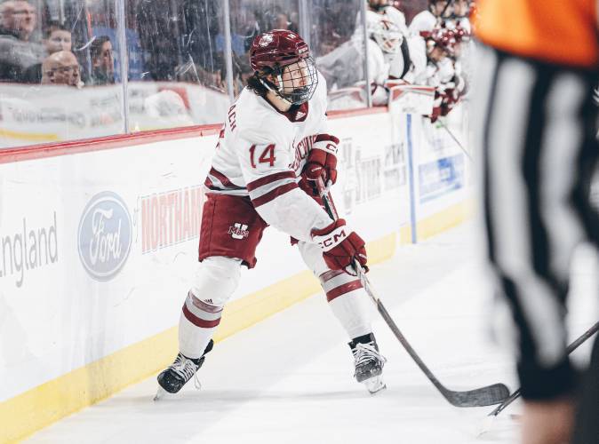 UMass’ Ryan Lautenbach (14) scored the game’s first goal in the Minutemen’s 4-0 win over Boston University on Saturday night at Agganis Arena in Boston.