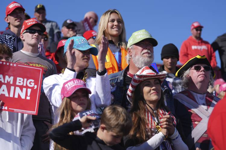 Supporters listen to former President Donald Trump before the election.