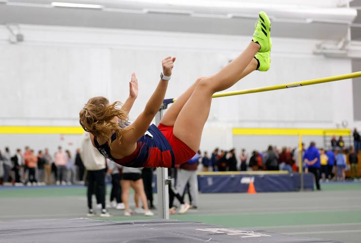 Mahar’s Stella Moore clears 5 feet, 2 inches for a first place finish and school record in the high jump Thursday at Smith College.