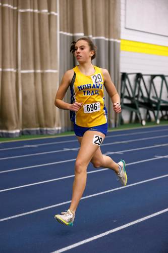 Mohawk Trail’s Virginia Krezmien runs to a first place finish in the girls one mile Thursday at Smith College.