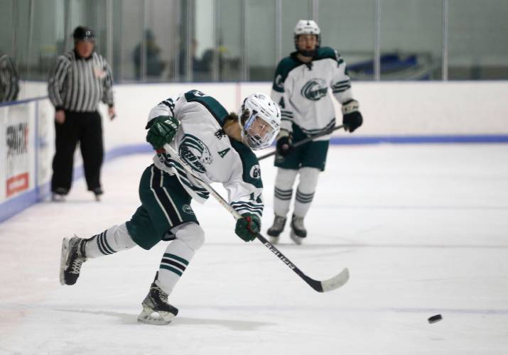 Greenfield’s Matt Garvin (14) fires a shot against Easthampton during action last season at Collins-Moylan Arena in Greenfield.