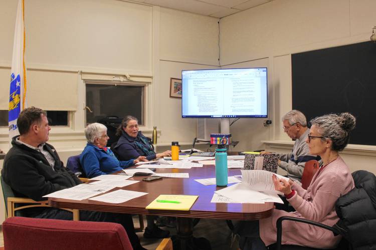 From left, Leyden Planning Board member David Curtis, member Emily Yazwinski, Liz Kidder, Chair James Brodeur and alternate Devorah Vester review a proposed bylaw regarding accessory dwelling units on Wednesday.