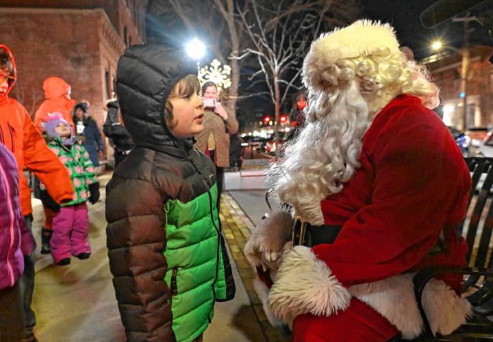 Leo Fondi, 5, of Turners Falls, talks with Santa at Spinner Park on Friday as part of “It’s a Wonderful Night in Turners Falls.”