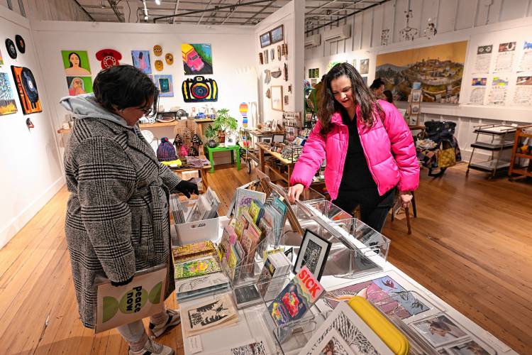 Sisters Dani and Nicole Letourneau of Greenfield shop at Waterway Arts as part of “It’s a Wonderful Night in Turners Falls” on Friday.